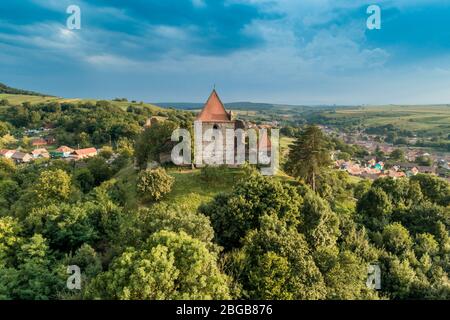 Aerial drone view of Slimnic Fortress (Stolzenburg), located on a Burgbasch hill on a Sibiu-Mediaș road in Transilvania, Romania. Travel spots in Roma Stock Photo