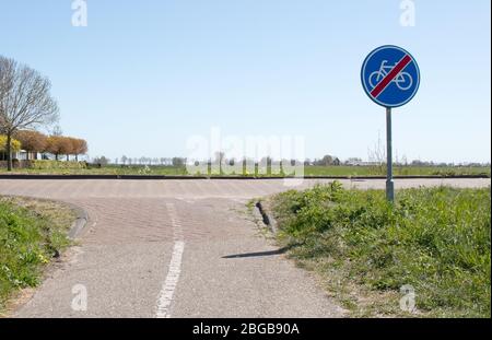 B40 - End of bicycle zone. Road sign indicating the end of the obligatory cycle path or lane, reserved for cyclists Stock Photo
