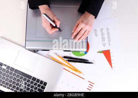 Female hand using graphics tablet on table close up Stock Photo
