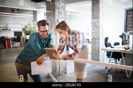 Group of business people and software developers working as a team in office Stock Photo