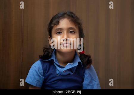 Indian school girl looking at camera Stock Photo