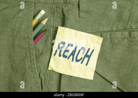 Conceptual hand writing showing Reach. Concept meaning the distance within which something can be touched or grabbed Writing equipment and green note Stock Photo