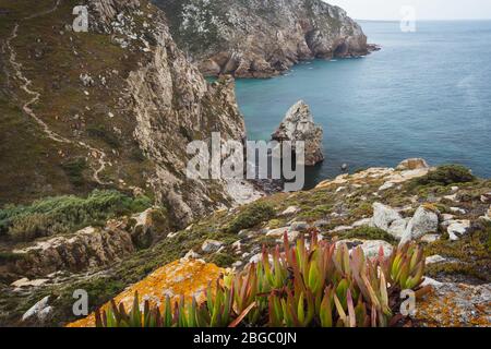 Rock cliffs by the sea at Beach Lourical on Cabo da Roca, Sintra, Portugal. Stock Photo