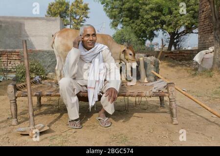 farmer talking on phone Stock Photo