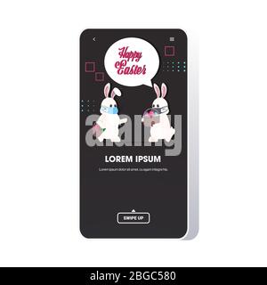 rabbits in medical masks holding baskets with eggs happy easter spring holiday coronavirus pandemic concept greeting card lettering smartphone screen mobile app vector illustration Stock Vector