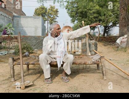 farmer talking on phone Stock Photo