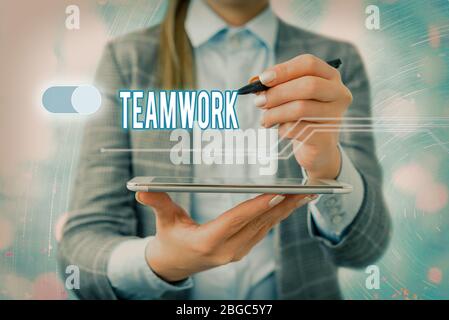 Handwriting text writing Teamwork. Conceptual photo combined action of group especially when effective and efficient Stock Photo