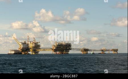 accommodation work boat attach to oil platform at sea form scheduled maintenance
