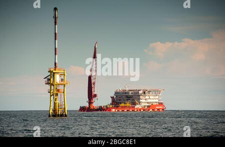 accommodation work boat or AWB anchorage at oil field for oil platform maintenance