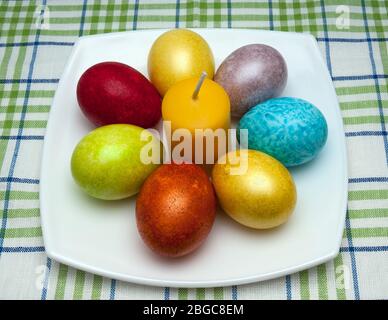 Coloured eggs for easter on white plate Stock Photo