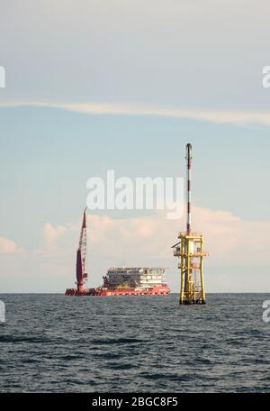 accommodation work boat or AWB anchorage at oil field for oil platform maintenance