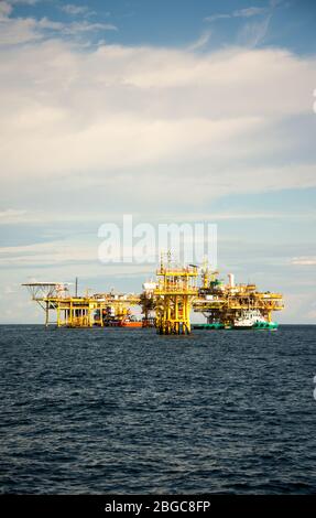 accommodation work boat attach to oil platform at sea form scheduled maintenance