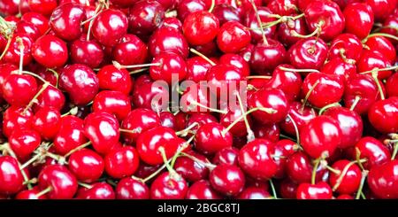 Red cherries panoramic background, close up of cherries on a market Stock Photo