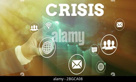 Writing note showing Crisis. Business concept for time when difficult or important decision must be made danger Stock Photo