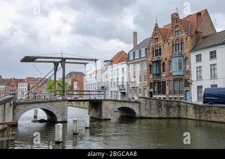 Drawbridge in Bruges, Belgium. Traditional bride over canal in Brugge. Stock Photo