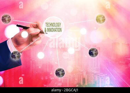 Conceptual hand writing showing Technology And Innovation. Concept meaning Application of better Solution for New Market Need Elements of this image f Stock Photo
