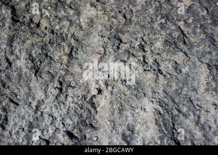 Grey textured stone background in breakwater Stock Photo