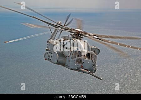 The CH-53K King Stallion successfully plugs into a funnel-shaped drogue ...