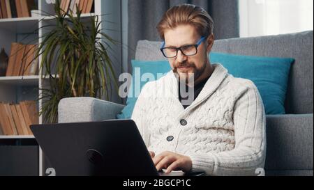 Middle-aged male working remotely Stock Photo