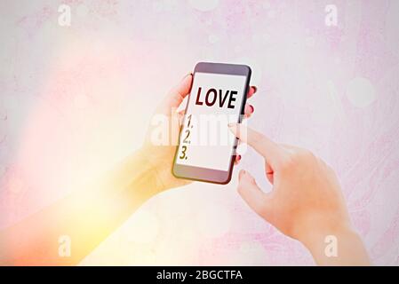 Writing note showing Love. Business concept for feeling of strong or constant affection for a demonstrating Feel deep romantic Stock Photo