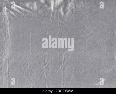 Silver fabric texture abstract background. Gray shiny chrome fabric  surface. Stock Photo