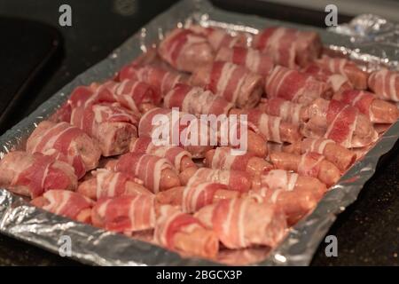 Preparing pigs in blankets Stock Photo