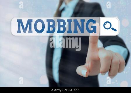Writing note showing Mobbing. Business concept for Bulling of individual specially at work Emotional abuse Stress Stock Photo