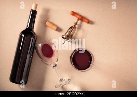 Wine tasting, top shot on a brown background, with a cork, corkscrew, and a bottle, with a place for text Stock Photo