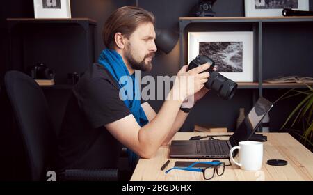 Photographer reviewing shots, side view Stock Photo