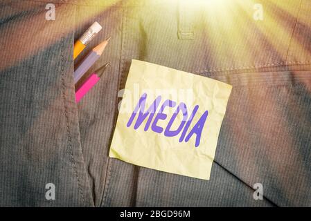 Conceptual hand writing showing Media. Concept meaning the main means of mass communicationthat are regarded collectively Writing equipment and green Stock Photo