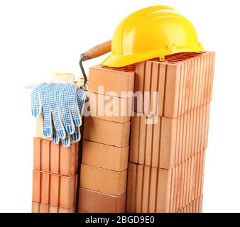 New bricks and building tools, isolated on white Stock Photo