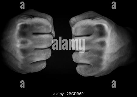 Man power concept, male fist on a black background, fight concept. Stock Photo