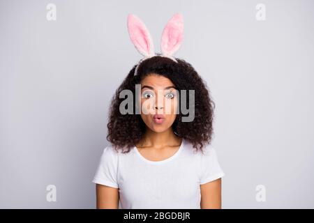 Close-up portrait of her she nice attractive lovely charming amazed wavy-haired girl wearing pink rabbit ears festal look pout lips isolated over Stock Photo