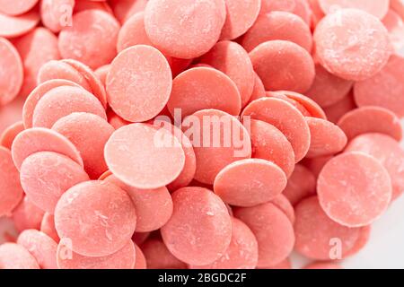 Pink Chocolate Chips Melting Chocolate Shapes White Background