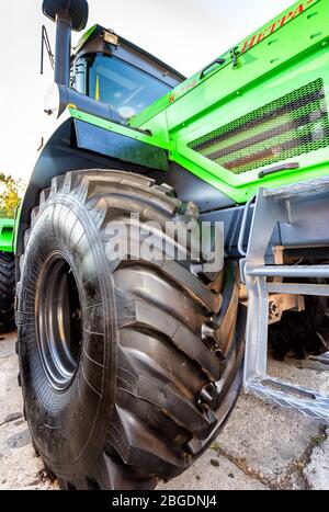 Samara, Russia - September 23, 2017: Big wheel of new modern agricultural wheeled tractor Stock Photo