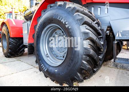 Samara, Russia - September 23, 2017: Big wheel of new modern agricultural wheeled tractor Stock Photo