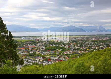 View over the cityscape of Bodo, Norway. Houses in the foreground & the sea & mountains in the background, Scandinavia. Bodø is a municipality in Nord Stock Photo