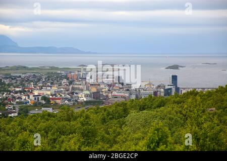 View over the cityscape of Bodo, Norway. Houses in the foreground & the sea & mountains in the background, Scandinavia. Bodø is a municipality in Nord Stock Photo