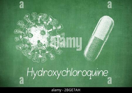 Hydroxychloroquine formula, medicine substance. Drug used in treatment for coronavirus SARS-CoV-2. Active in COVID-19 therapy. Chalk on board. Stock Photo