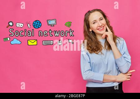 Social network concept - girl on a pink background with icons and text. Close up. Stock Photo