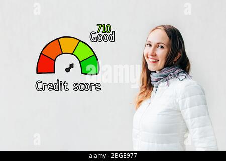 Credit score good concept - girl on a white background with icons and text. Close up. Stock Photo