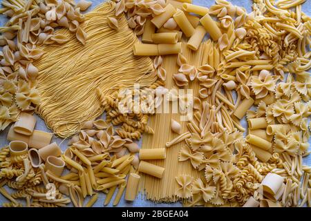 Variety of types and shapes of dry Italian pasta Stock Photo