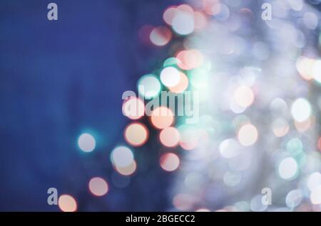 Blurred blue urban background scene. Background blue blurry bokeh. Colorful twinkling bokeh  lights. Retro style toned Stock Photo