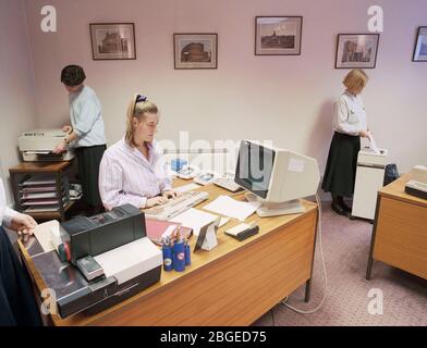 Workers in a typical 1990 office, UK Stock Photo