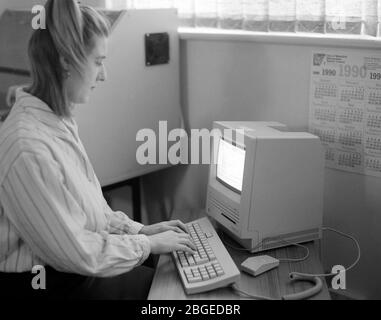 Workers in a typical 1990 office, UK Stock Photo