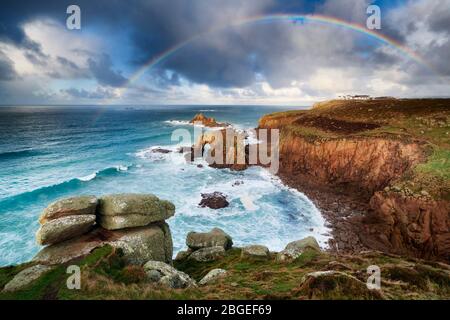 Rainbow over the clifftops at Land's End, Cornwall Stock Photo
