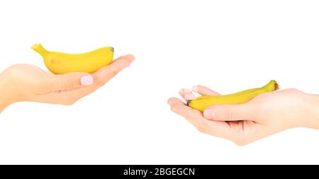 Female hands holding mini banana, isolated on white Stock Photo