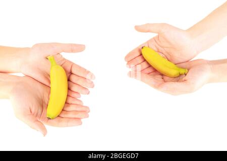 Female hands holding mini banana, isolated on white Stock Photo