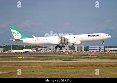 EP-MMQ Iranian Mahan Air Airbus A340-642 at Malpensa (MXP / LIMC), Milan, Italy Stock Photo