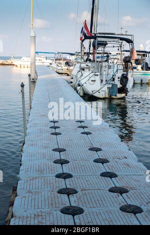 CHON BURI, THAILAND - FEBRUARY 16, 2019: Floating walkways of yacht harbour. Pattaya beach, Thailand. South East Asia. Stock Photo